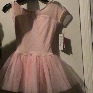 Hello I am selling an Keyhole tutu dress it’s pink and  new and is an medium